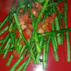 A picture of Asparagus with Roma tomatoes.