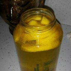 A picture of Lemon, cinnamon, tumeric & cayenne pepper with coconut water.
