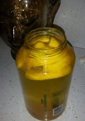 A picture of Lemon, cinnamon, tumeric & cayenne pepper with coconut water.