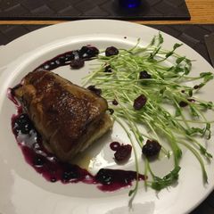 A picture of Foie Gras With Blueberry Sauce.