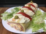 Una foto de pionono relleno con palmito