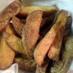 A picture of twice cooked tater wedges.