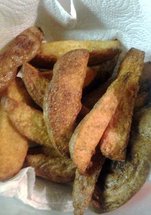 A picture of twice cooked tater wedges.