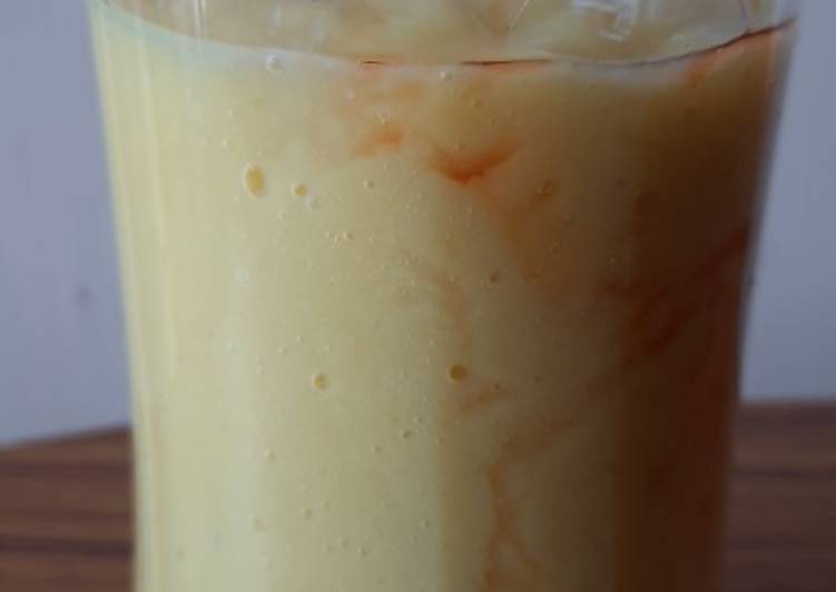 Mango shake with strawberry syrup