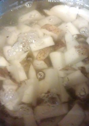 A picture of MASHED POTATOES WITH SKIN ON THEM ,.