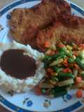 Breaded and tenderized chicken breast