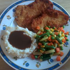 Breaded and tenderized chicken breast A picture of Breaded and tenderized chicken breast.