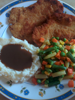 A picture of Breaded and tenderized chicken breast.