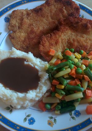 A picture of Breaded and tenderized chicken breast.