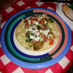 A picture of Fish tacoz w/cucumber Pico de gallo.