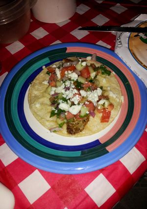 A picture of Fish tacoz w/cucumber Pico de gallo.