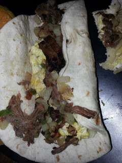 A picture of Left over roast beef breakfast burrito.