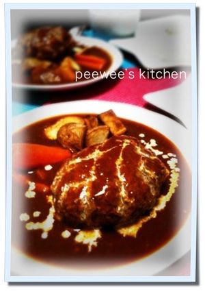 A picture of Hamburger Steaks Simmered in Sauce.