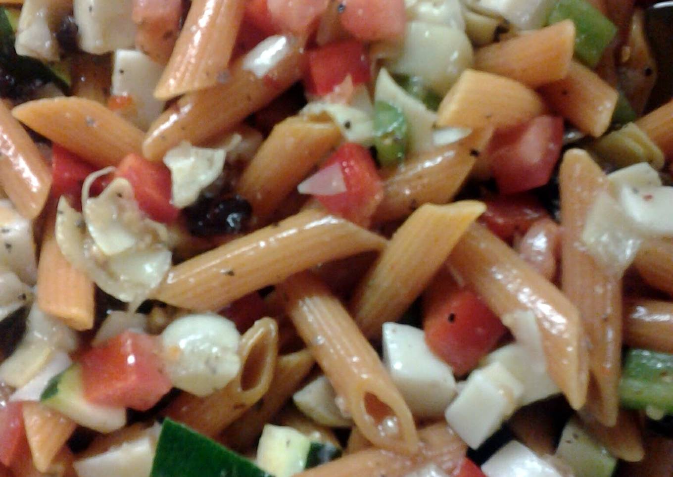 Pasta salad with a bowl of vegetables