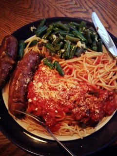A picture of sausage and spaghetti.