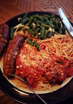 A picture of sausage and spaghetti.