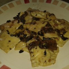 A picture of 3 cheeses and smoked ham ravioli.
