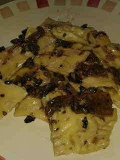 A picture of 3 cheeses and smoked ham ravioli.