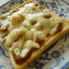 A picture of Last Night's Curry is This Morning's Cheese Toast.