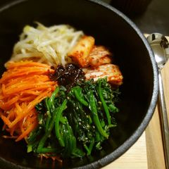 Stone Bowl Bibimbap Made in a Nambu Tekki Iron Pot A picture of Stone Bowl Bibimbap Made in a Nambu Tekki Iron Pot.