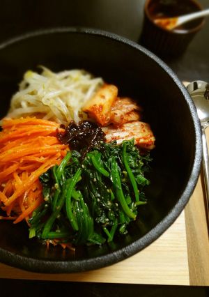 A picture of Stone Bowl Bibimbap Made in a Nambu Tekki Iron Pot.