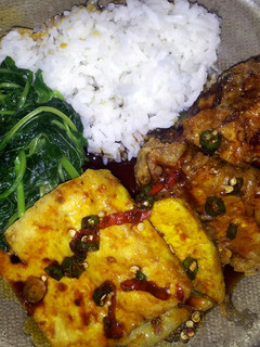 A picture of Fried yellow tofu with spicy soy sauce.