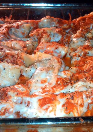 A picture of shells stuffed with sausage, spinach & garlic.