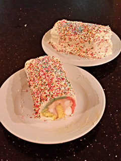 A picture of Rainbow Sherbet ( Sorbet ) Filled Striped Vanilla Cake Roll.