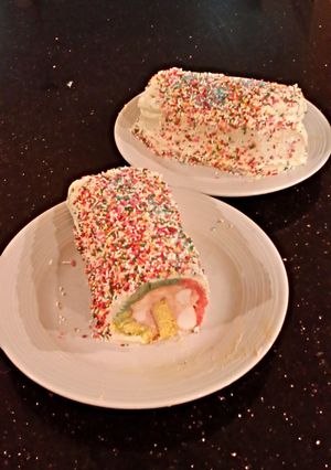 A picture of Rainbow Sherbet ( Sorbet ) Filled Striped Vanilla Cake Roll.