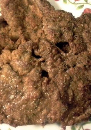 A picture of breaded steak.