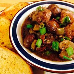 A picture of Coq Au Vin, Chicken In Red Wine.