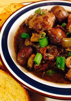 A picture of Coq Au Vin, Chicken In Red Wine.