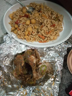 A picture of Jallop macaroni with baked chicken.