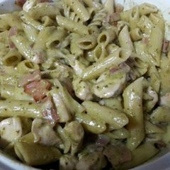 A picture of Creamy pesto pasta with camembert bacon and chicken.