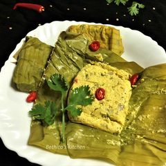 A picture of Bhapa Posto Paturi (Steamed Poppy Seeds Paste in Banana Leaf).