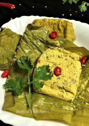 A picture of Bhapa Posto Paturi (Steamed Poppy Seeds Paste in Banana Leaf).
