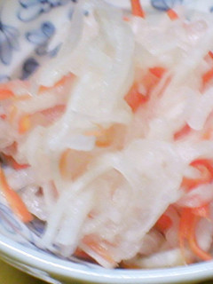 A picture of Celebratory Red and White Namasu (Marinated Daikon and Carrot Salad) for New Year's.