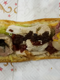 A picture of 3 way Xmas leftovers sandwich.