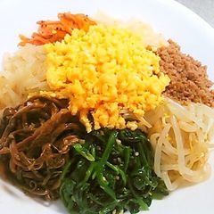 A picture of 8 Namul Bibimbap with Lots of Vegetables.