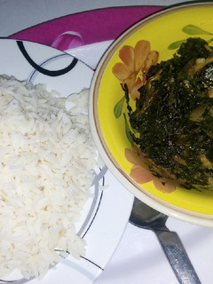 A picture of White rice and vegetables soup.