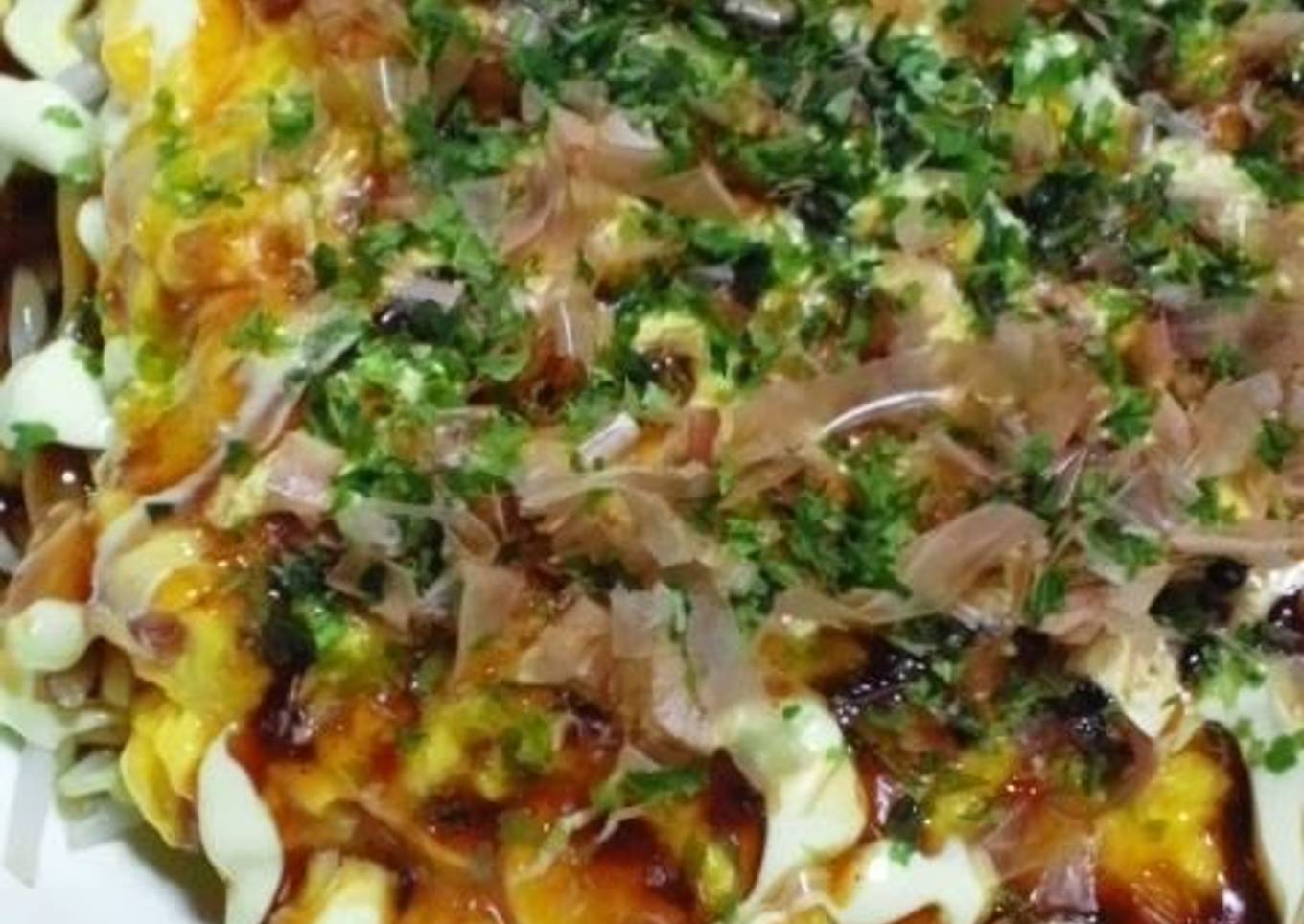 Okonomiyaki (Japanese delicious pancakes) with bean sprouts and eggs is easy to prepare