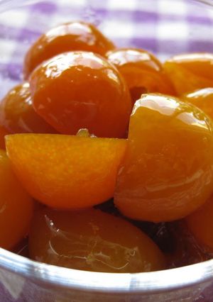 A picture of Kumquats Simmered In Rich Sugar Syrup.