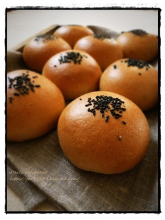 A picture of Black Sesame Anpan Flavoured with Brown Sugar (Bread Rolls Filled with Beans Paste).