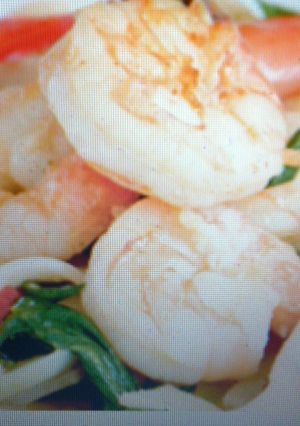 A picture of Garlic King Prawns with pak choy and fresh noodles.