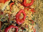 A picture of stuffed red peppers with quinoa
