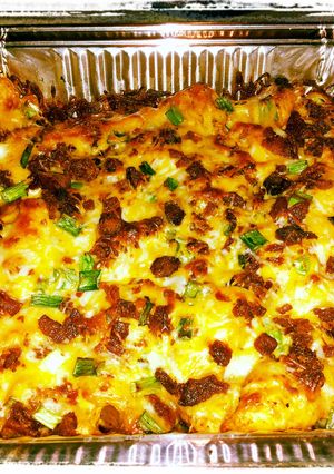 A picture of loaded baked potato an buffalo chicken casserole.