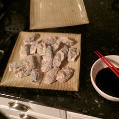 A picture of Boiled spinach and tofu dumplings.