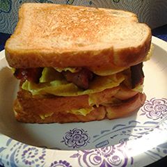 A picture of Folded egg and bacon sandwich.