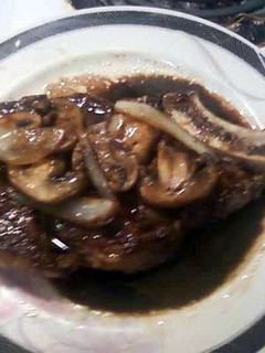 A picture of Rib steaks with a Balsamic Sauce.