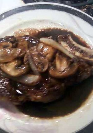 A picture of Rib steaks with a Balsamic Sauce.